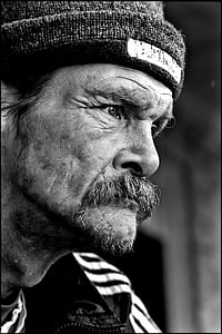 man looking at left gray scale photo thumbnail