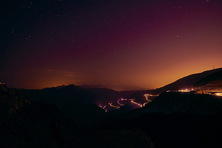 silhouette of mountain during nighttime thumbnail
