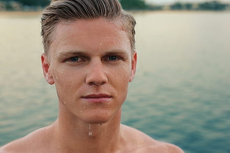 man with blond hair with water dripping from his chin thumbnail
