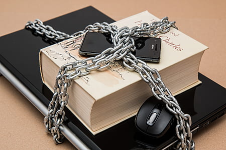 Black Android Smartphone on Top of White Book thumbnail