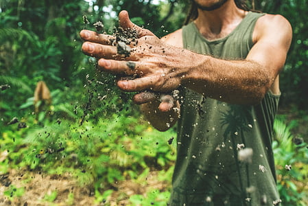 person holding dirt thumbnail