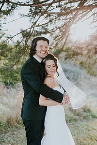 wedding couple under tree thumbnail