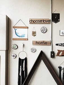 assorted wall decors on white painted wall thumbnail