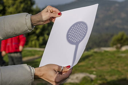 person holding white printer paper thumbnail