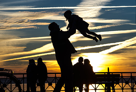 man lifting kid photo thumbnail