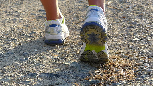 person's wearing white low-top running shoes thumbnail