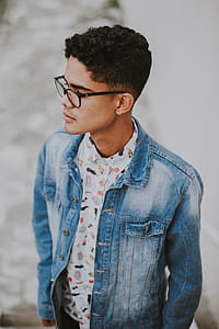 man wearing blue denim jacket and black framed eyeglasses thumbnail