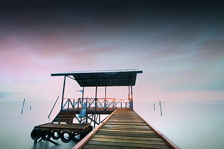 brown dock on body of water thumbnail