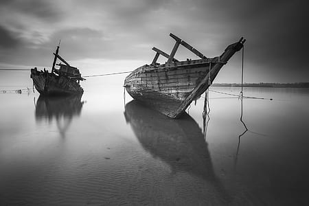 2 Boats on the Body of Water Under Cloudy Sky during Daytime in Greyscale Photo thumbnail