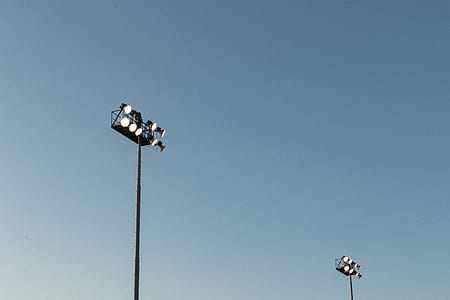 black stadium light under blue sky thumbnail