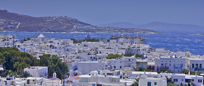 aerial photo of white buildings surrounded by body of water thumbnail