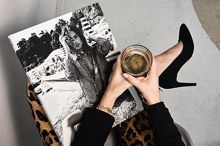 grayscale photo of woman on person's lap thumbnail