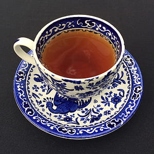 white and blue ceramic cup and saucer thumbnail
