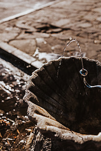 Drinking fountain with stream of water on the sidewalk thumbnail