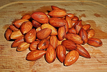 almond nuts placed on brown surface thumbnail