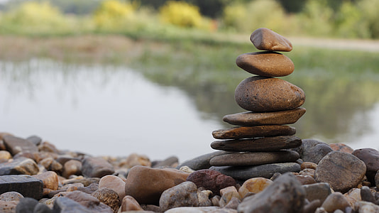 person showing brown rocks balancing thumbnail