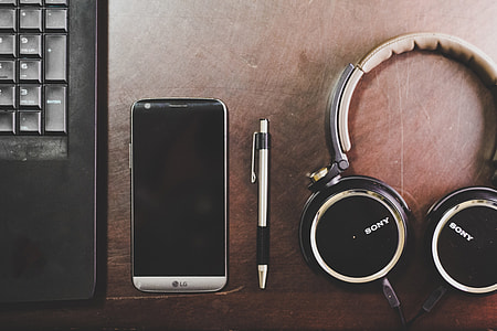 Laptop computer, mobile smartphone and music headphones thumbnail