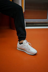 unpaired white low-top lace-up shoe thumbnail