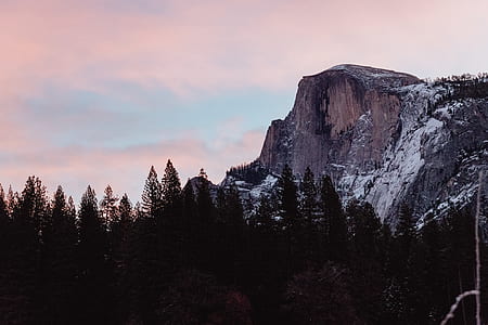 landscape photography of brown mountains near green trees thumbnail