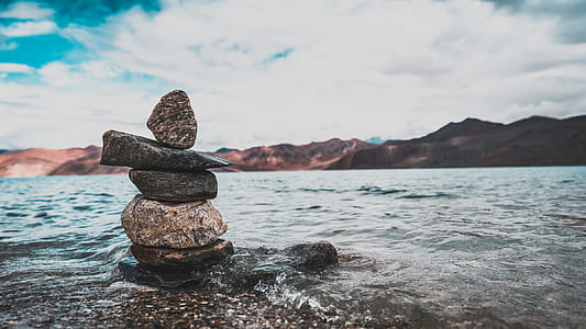 selective focus photography of balanced stones thumbnail