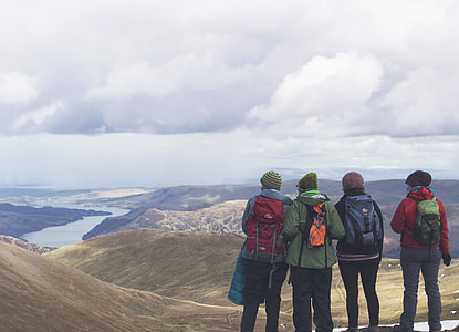people standing on beige hill during daytime thumbnail