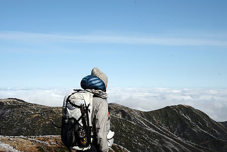 man on top of mountain thumbnail