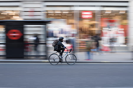 panning photography of man riding on bicycle thumbnail