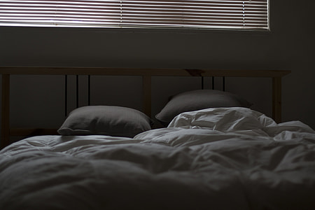 white quilt inside room thumbnail