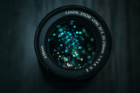 selective focus photography of black Canon telephoto lens with bokeh thumbnail