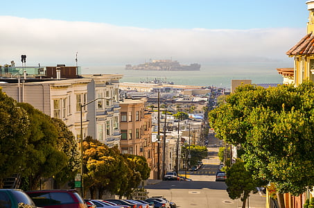 photo of brown and white buildings during daytime thumbnail