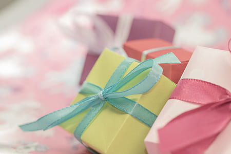selective focus photography of green box on pink surface thumbnail