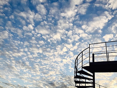 metal spiral staircase during daytime thumbnail