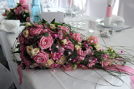 pink and beige petaled flower bouquet on table thumbnail