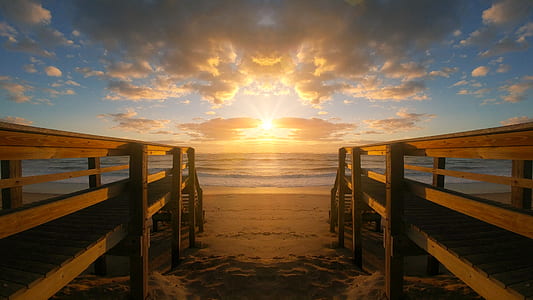 brown wooden dock on seashore thumbnail