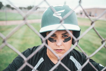 Woman Wearing Green and White Sports Helmet thumbnail