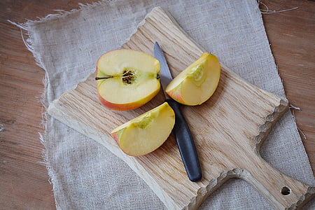 sliced apple fruit on brown chopping board thumbnail