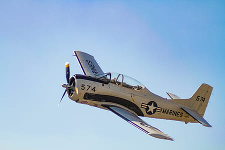 white Marines 574 plane in sky thumbnail