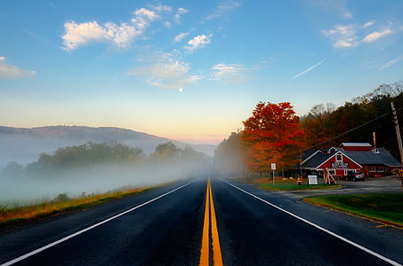 black asphalt road under blue sky during daytime thumbnail