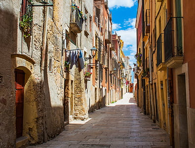 alley between concrete houses thumbnail