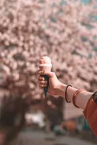 person holding mocha ice cream thumbnail