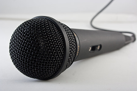 black and gray corded microphone on white surface thumbnail
