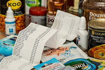 white receipt paper in middle of assorted items thumbnail