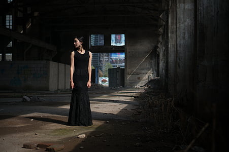 woman in black sleeveless gown thumbnail
