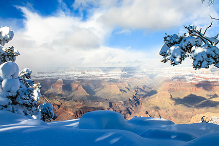 aerial photography of brown and green mountains under white clouds thumbnail