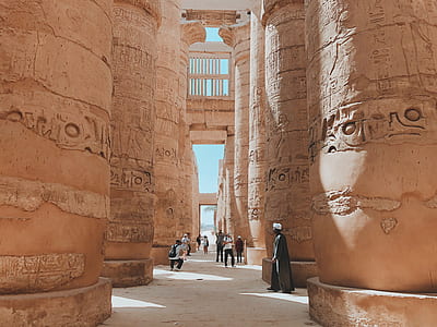 architectural photography of beige stone pillars thumbnail