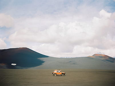 Orange Vehicle on Brown Sand thumbnail