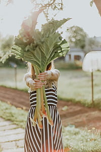 woman holding green leaves thumbnail