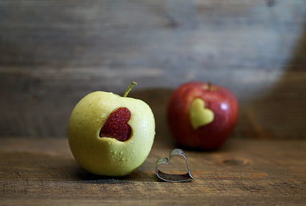 yellow and red apples on brown surface thumbnail