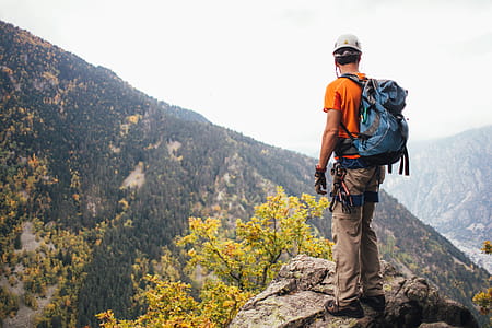 Hiker Climbing Mountains Photo thumbnail