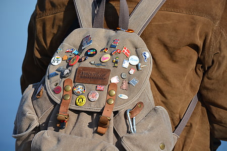 person in brown jacket with leather backpack thumbnail